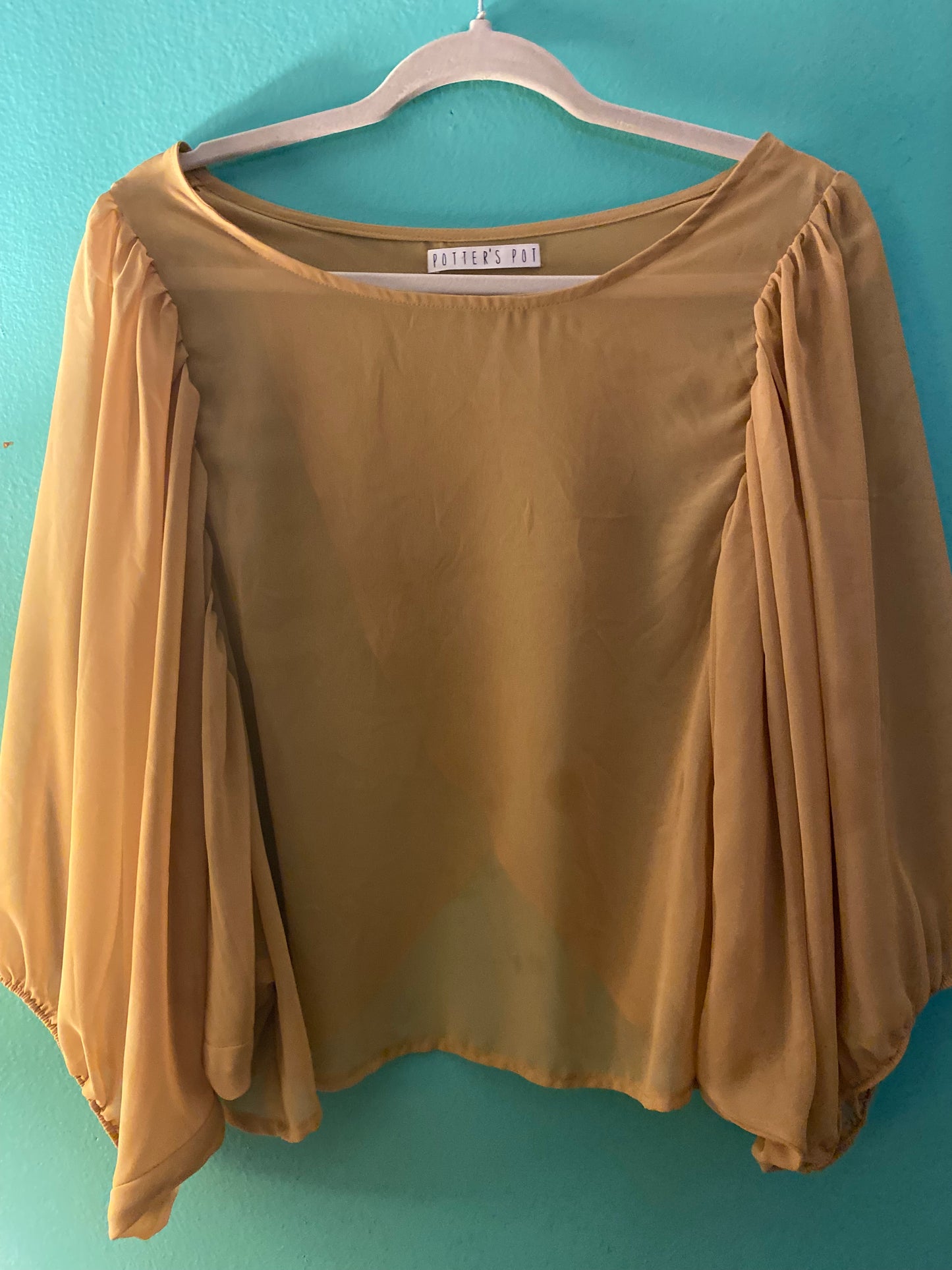 Porter pot mustard flowing open back blouse